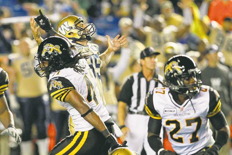 John Woods / The Canadian Press
Kicker Eric Wilbur reacts as his field goal attempt misses wide left in the final seconds of Wednesday night's pre-season game.