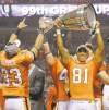 Postmedia Postmedia News
Arlen Redekop / Postmedia News archives
Geroy Simon lifts the Grey Cup and celebrates with teammates after beating guess who? Why the Bombers, of course.