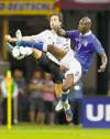 CP
Frank Augstein / THE ASSOCIATED PRESSItaly�s Mario Balotelli (right) and Germany�s Mats Hummels duel for the ball in Thursday�s semifinal.