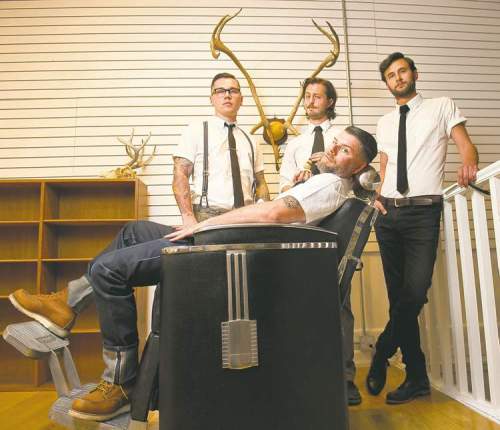 photos by DAVID LIPNOWSKI / WINNIPEG FREE  PRESS
Dru Barrow (left), Walter Spooner, Jeremy Regan and Mason Melle are barbers at Hunter and Gunn.