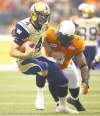 CP
Winnipeg Blue Bombers' quarterback Buck Pierce, left, is sacked by B.C. Lions' Keron Williams during the first half of a CFL football game in Vancouver, B.C., on Friday June 29, 2012. THE CANADIAN PRESS/Darryl Dyck