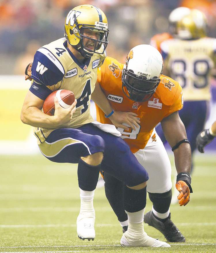 CP
Winnipeg Blue Bombers' quarterback Buck Pierce, left, is sacked by B.C. Lions' Keron Williams during the first half of a CFL football game in Vancouver, B.C., on Friday June 29, 2012. THE CANADIAN PRESS/Darryl Dyck