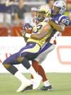 REUTERS
Olivier Jean / reuters
Winnipeg Blue Bombers receiver Chris Matthews snags a pass in front of Montreal�s Seth Williams during first-half action in Montreal on Friday night.