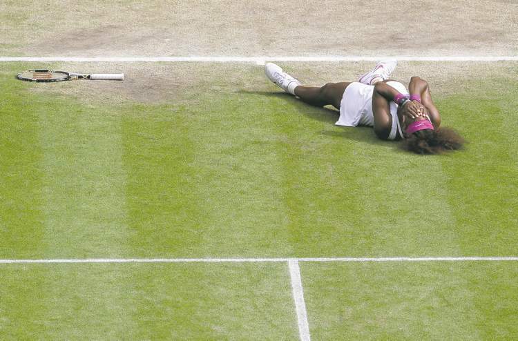 Anja Niedringhaus / the associated press
Serena Williams isn't lying down on the job, she is simply overwhelmed by joy, having just won her fifth Wimbledon singles title.
