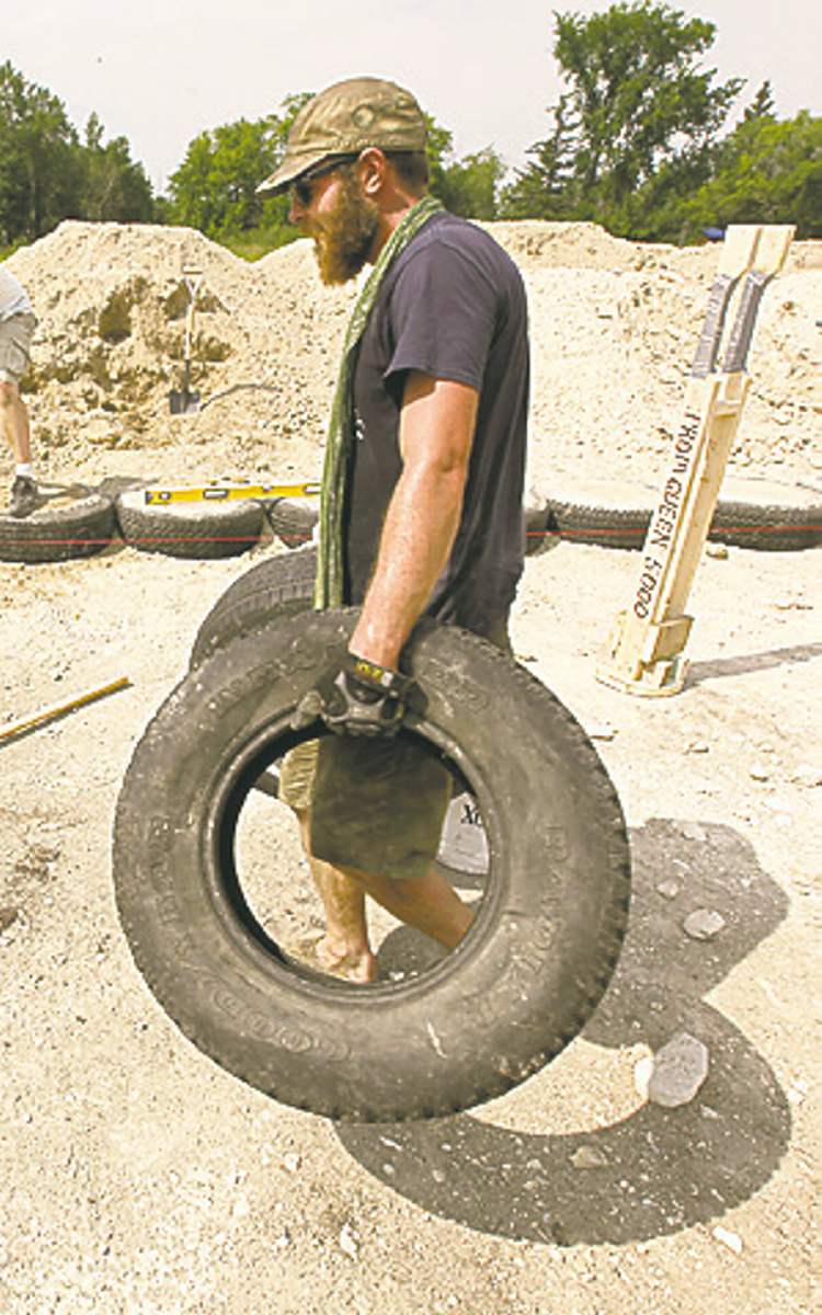 Winnipeg Free Press
Plantz moves tires for Bennett and Zenert to fill.