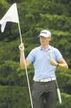 JOE BRYKSA / WINNIPEG FREE PRESS
Don't they have people for this stuff? Player Chris Killmer handles pin duty on 18.