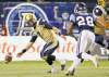 Mark Blinch / reuters
The ball slips from quarterback Alex Brink's hands as Argos' Brandon Isaac comes charging in during the second half Wednesday night at Rogers Centre.