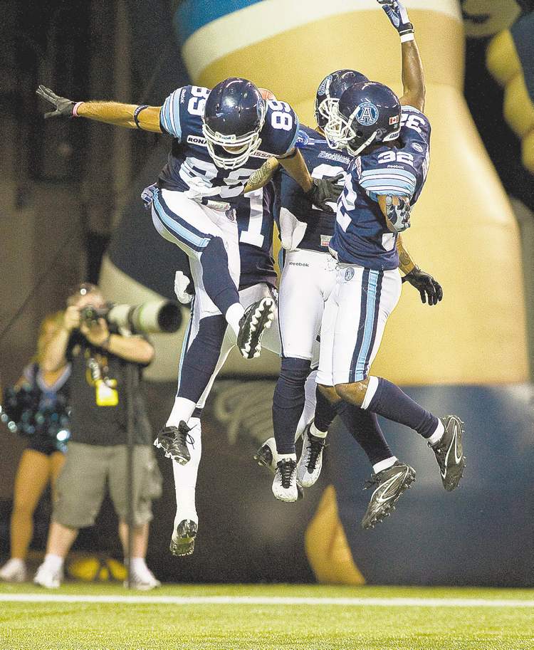 CP
Aaron Vincent Elkaim / the canadian press
An Argos trio goes aloft to celebrate a Chad Owens touchdown against the Bombers in the first half Wednesday night in Toronto.