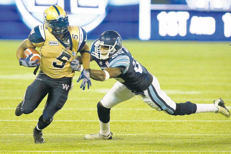 CP
Aaron Vincent Elkaim / the canadian press
Bombers running back Chad Simpson tries to escape the clutches of Argonauts� Patrick Watkins in the second half Wednesday night.