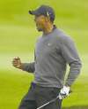CP
Jon Super / the associated pressTiger Woods gives his patented fist pump and yell after birdieing the 18th hole at Royal Lytham & St. Annes in the second round of the British Open on Friday.
