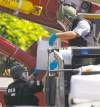 Alex Brandon / The Associated Press
Explosives from the alleged gunman's apartment are loaded with sand into a truck for disposal.