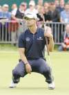 CP
PHOTOS BY Chris Carlson / The Associated PressAdam Scott of Australia sinks after missing a putt on the 18th green at the British Open Sunday; his slide paved the way for  Ernie Els (inset) to kiss the claret jug as 2012 champ.