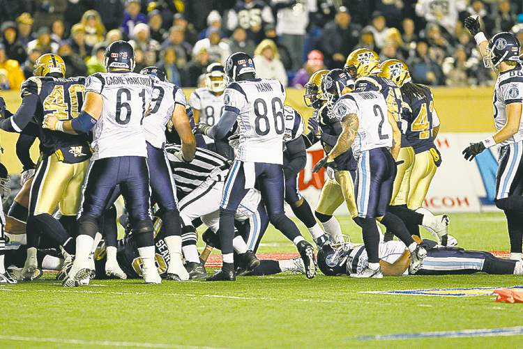 Winnipeg Free Press
John Woods / WINNIPEG FREE PRESS ARCHIVES
Steven Jyles on the turf (right) after Johnny Sears' hit last October.