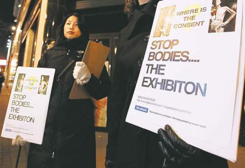 Winnipeg Free Press
john woods / winnipeg free press archives
Judith Cheung protests the Bodies exhibition on Portage Avenue on Nov. 12, 2010.