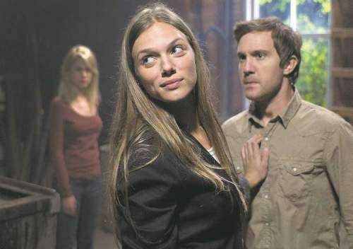 Philippe Bosse/Syfy
Spiridakos with Sam Huntington in a scene from Being Human.