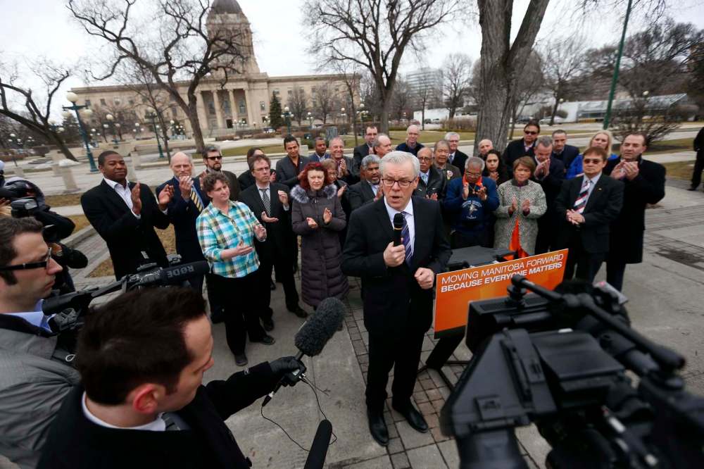 WAYNE GLOWACKI / WINNIPEG FREE PRESS
NDP Leader Greg Selinger speaks Wednesday after the election was called, surrounded by supporters and members of the media.
