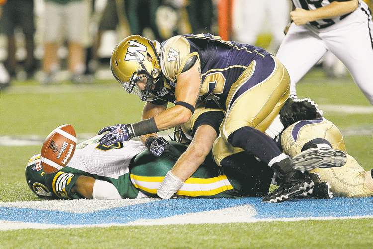 CP
John Woods / The Canadian Press ARCHIVES
It looked as if the Eskimos were going to have a shot to win the game until QB Steven Jyles came down with a little fumble-itis thanks to a hustling DL Jake Thomas.