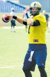 COLE BREILAND / WINNIPEG FREE PRESS
Bombers QB Alex Brink -- with a little spring in his step -- Monday at practice. The team was feeling relaxed after their first win of the season.
