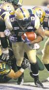 MIKE DEAL / WINNIPEG FREE PRESS archives
Chad Simpson (5) churns for yards during the Winnipeg Blue Bombers' home opener against the Edmonton Eskimos Thursday.