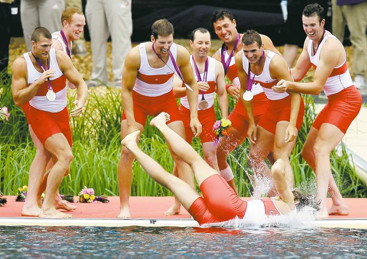 CP
Natacha Pisarenko / the associated press
Members of Canada�s men�s rowing eight toss a teammate into Lake Dorney after winning the silver medal at the Summer Olympics on Wednesday.