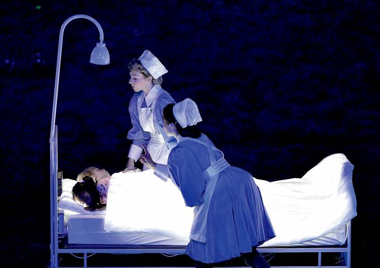 Tribune Media 
Nurses and children perform during the opening ceremonies for the London 2012 Summer Olympic Games in London.