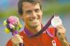 CP
Sean Kilpatrick / THE CANADIAN PRESS A bouquet, a big smile and a silver medal adorn Canada�s Adam van Koeverden after he came second in the men�s 1,000-metre kayak single (K1) final at the Olympics Wednesday,