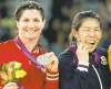 CP
Ryan Remiorz / the canadian pressTonya Verbeek shows her silver, Saori Yoshida tests her gold after 55-kg final.