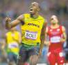 Tribune Media MCT
David Eulitt / Kansas City Star/  MCTUsain Bolt celebrates after winning gold in the 200-metre final with a time of 19.32 seconds at Olympic Stadium on Thursday.