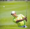 Tribune Media MCT
Tim Dominick / The State / MCTTiger Woods pitches to the ninth green during first-round action Thursday.