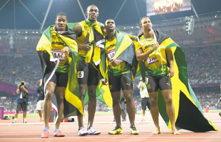 CP
Sean Kilpatrick / the canadian press
Jamaica�s 4x100-metre relay team celebrate their world record in London on Saturday. Usain Bolt is second from left.