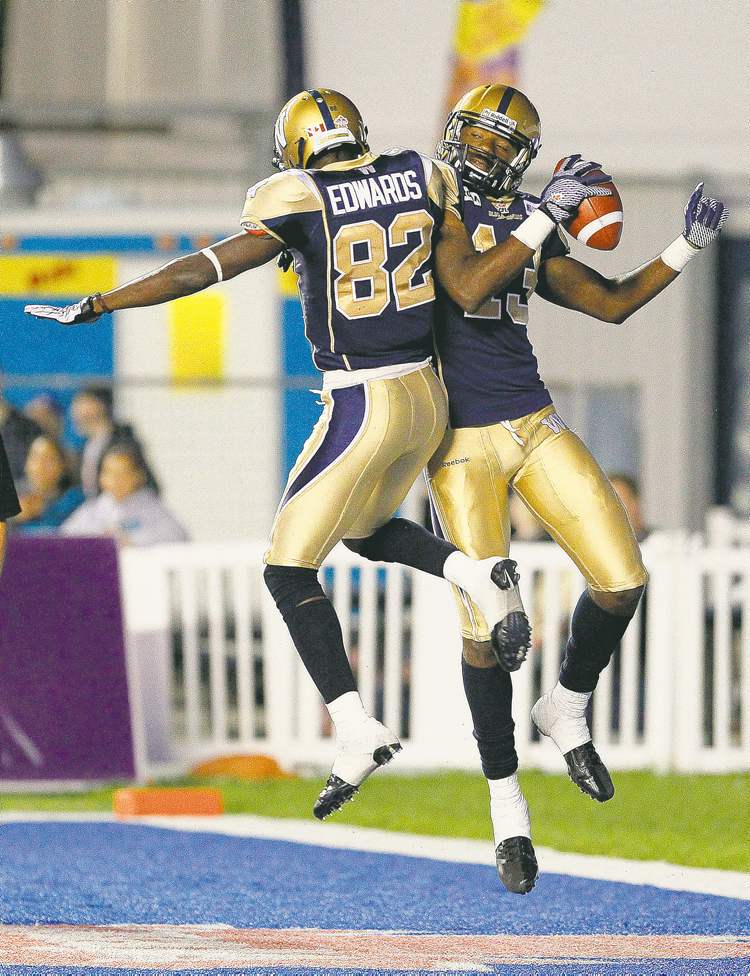 CP
John Woods / The Canadian Press
Bombers receivers Chris Matthews and Terrence Edwards celebrate Matthews� fourth-quarter touchdown. Both were a big part of Joey Elliott�s big night.