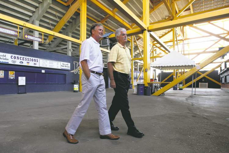 JOE BRYKSA / WINNIPEG FREE PRESS
Bomber president and CEO Garth Buchko (left) and Bomber vice-president and CFO Jim Bell at a policy announcement at Canad Inns Stadium Wednesday. Buchko will be among those handing out water.