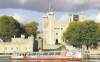 the associated press
A leisure boat on the Thames river passes passes the Tower of London.