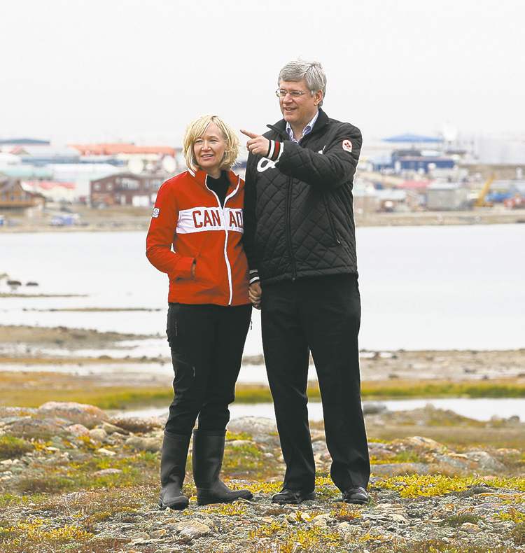 CP
ADRIAN WYLD / THE CANADIAN PRESS
Stephen Harper and wife Laureen overlook a harbour at Cambridge Bay, Nunavut, Thursday.