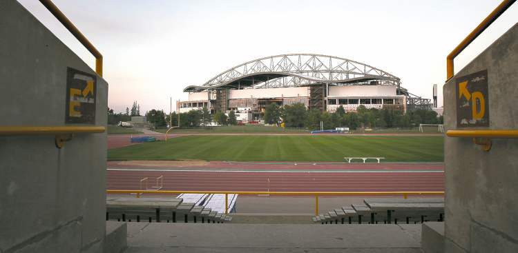 PHIL HOSSACK / WINNIPEG FREE PRESS
The west side of the new stadium is seen Thursday from an entranceway in the existing University Stadium. The completion of the new facility's playing surface is the next big job.
