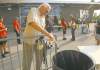 Bomber fan Ed Langlois dumps his bottled water at security check as he arrives at Canad Inns Stadium Friday night.