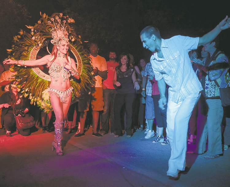 Melissa Tait / Winnipeg Free Press
Marcia Monteggia dances with Tom Cardaso during the inaugural Carnaval on Bannatyne Avenue Saturday night.
