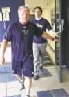 JOE BRYKSA / WINNIPEG FREE PRESS
New head coach Tim Burke enters a Monday news conference to announce that Joey Elliott will start at QB in Regina on Sunday.