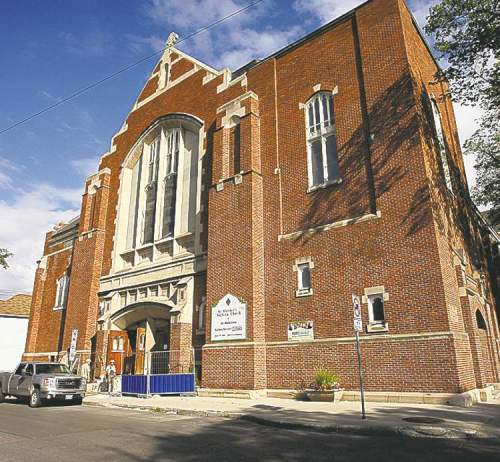 KEN GIGLIOTTI / WINNIPEG FREE PRESS
Crews work on the new entrance to the former St. Matthew's Anglican Church.