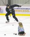 photos by WAYNE GLOWACKI / WINNIPEG FREE PRESS 
Olli Jokinen went for a skate at the MTS Iceplex Thursday. His daughter Emma, 8, slides him pucks to practise his one-timers.