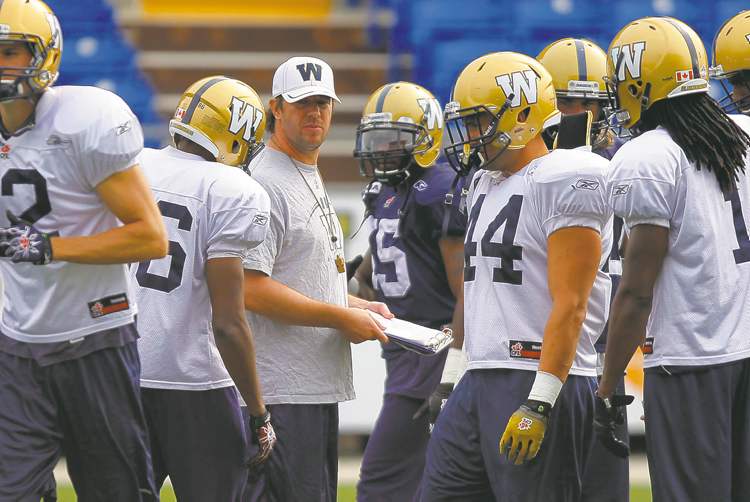 BORIS MINKEVICH / WINNIPEG FREE PRESS
Blue Bombers special teams coach Kyle Walters (centre) will be helping with the in-game management on Sunday in Regina.