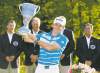 CP
michael dwyer / the associated pressRory McIlroy hoists the jug after winning the Deutsche Bank Championship at TPC Boston on Monday.