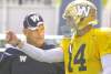 WAYNE GLOWACKI / WINNIPEG FREE PRESS
Blue Bombers offensive co-ordinator Gary Crowton and quarterback Joey Elliott talk shop at Thursday�s workout.