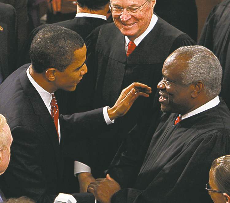 THE ASSOCIATED PRESS ARCHIVES
U.S. President Barack Obama greets Supreme Court Justice Clarence Thomas before his address to a joint session of Congress in 2009.