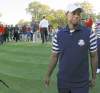 CP
Tiger Woods leaves Medinah after the Europeans won the Ryder Cup  Sept. 30. He says he wants to be a Ryder Cup captain, but not yet.