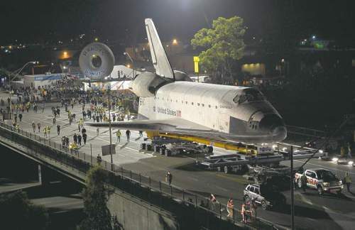 CP
The space shuttle Endeavour is slowly moved across Interstate 405 by a Toyota Tundra on its way to the California Science Center in Los Angeles.