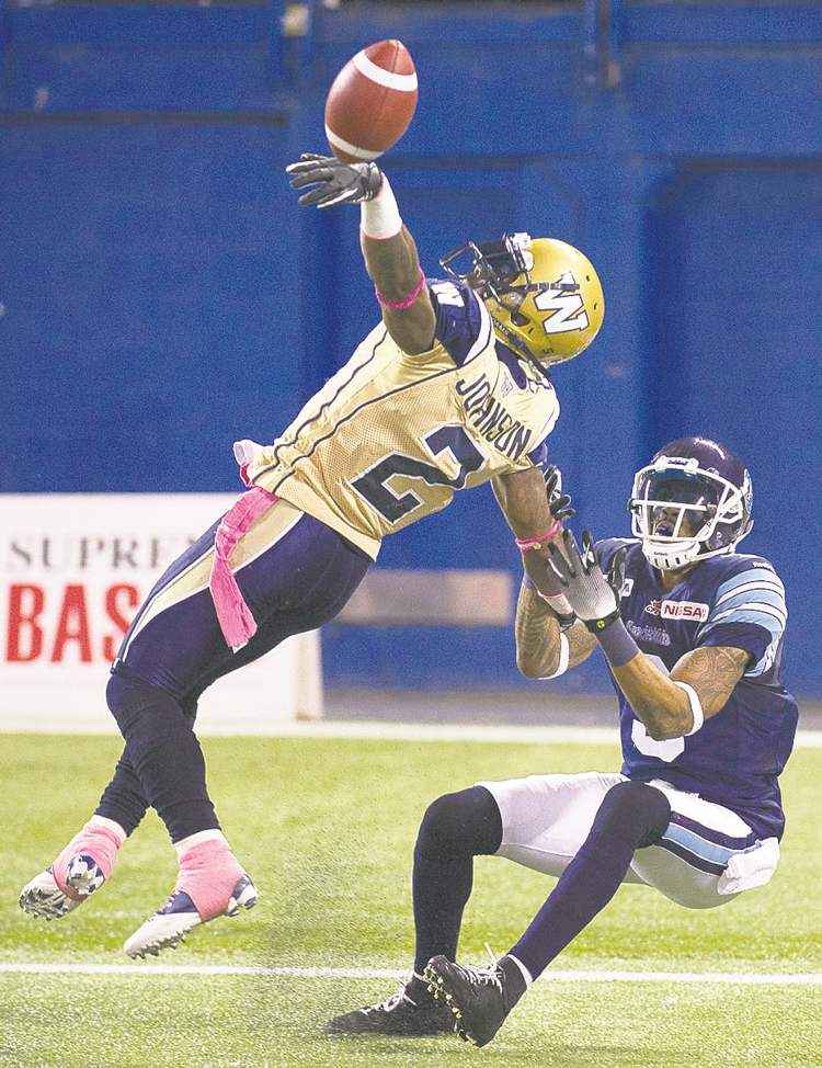 Nathan Denette / The Canadian Press
Bombers defensive back Jovon Johnson gets burned by Toronto receiver Maurice Mann for a big gain in the first half.