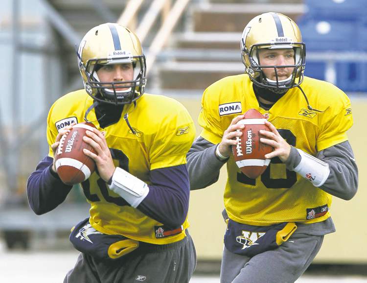 WAYNE GLOWACKI / WINNIPEG FREE PRESS
Winnipeg Blue Bomber QBs Justin Goltz (left) and R.J. Archer at team practice Tuesday. Blue coach Tim Burke said Goltz will see action Saturday.