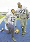 WAYNE GLOWACKI / WINNIPEG FREE PRESS 
Chris Matthews (left) with an injured Terrence Edwards after team practice Tuesday.