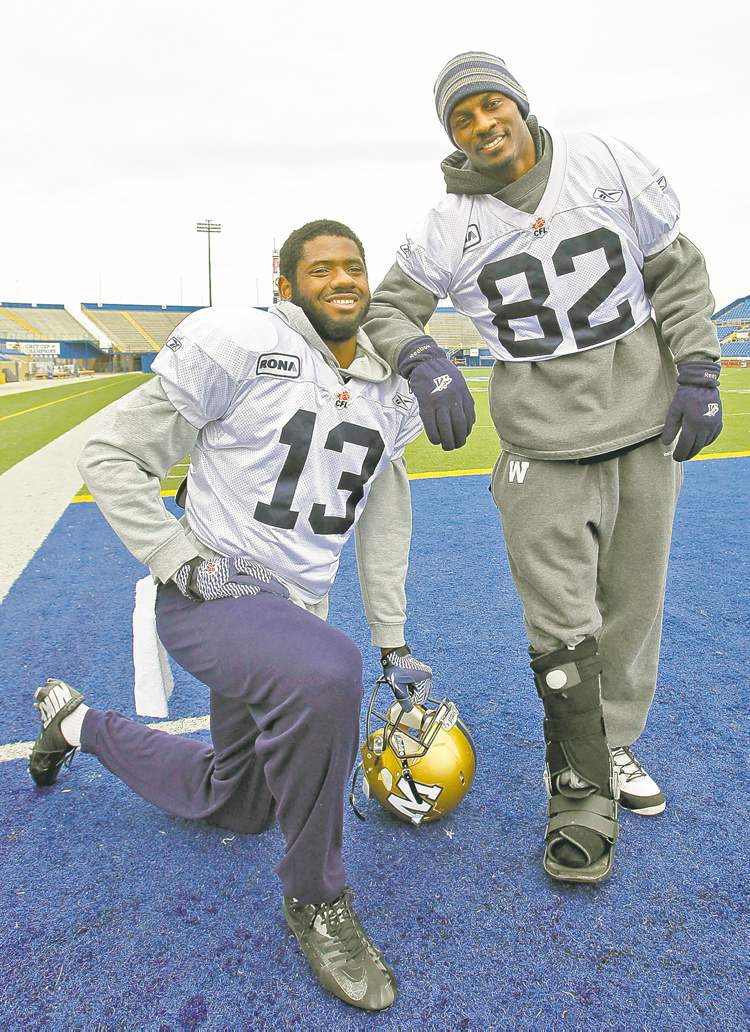 WAYNE GLOWACKI / WINNIPEG FREE PRESS
Chris Matthews (left) with an injured Terrence Edwards after team practice Tuesday.